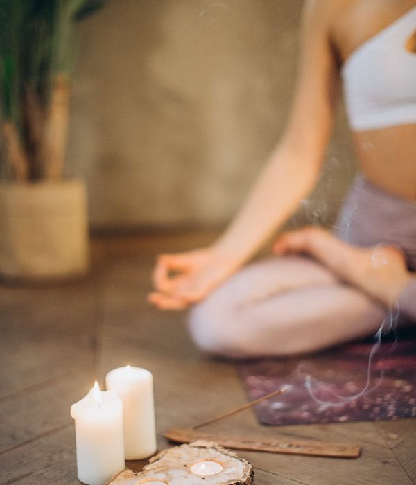 Woman in a calm yoga pose, embodying focus and serenity.